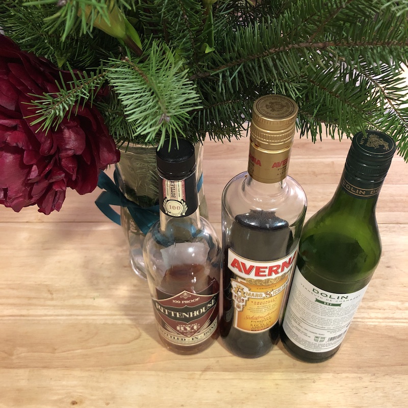 bottles of rye amaro and vermouth